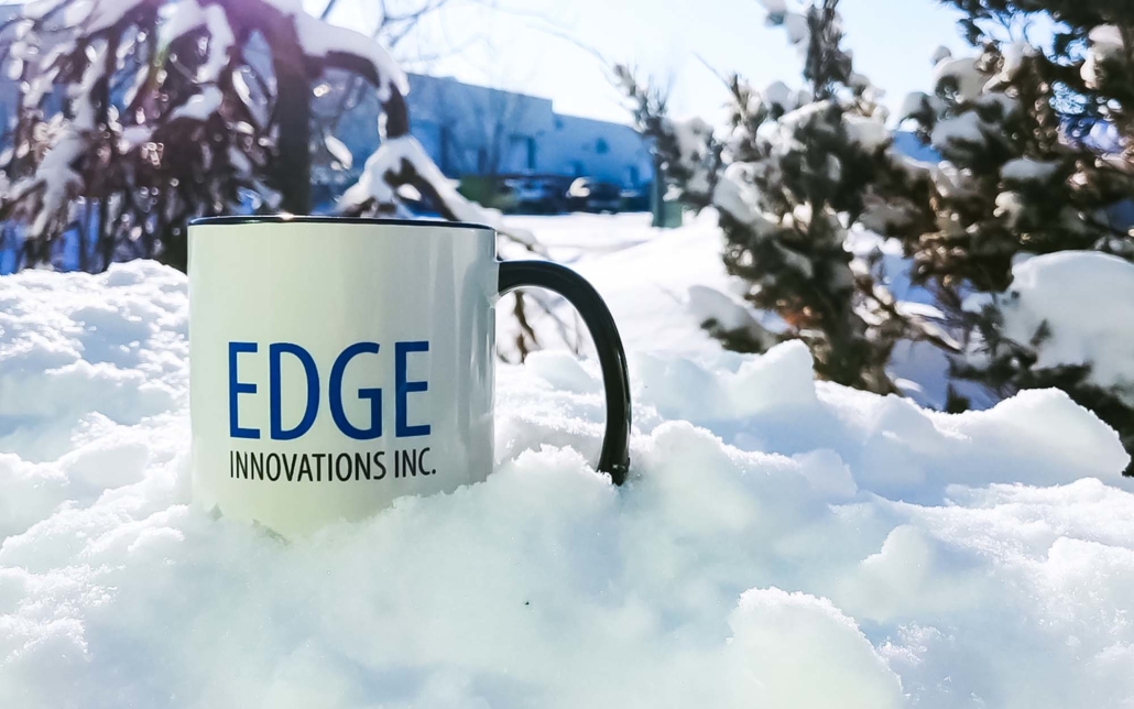 Edge Innovations Mug sitting in the snow